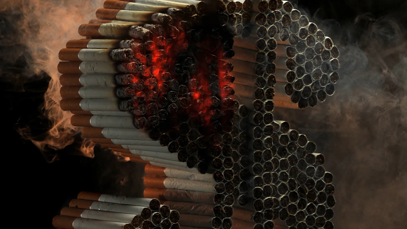 Cigarro aceso sobre superfície